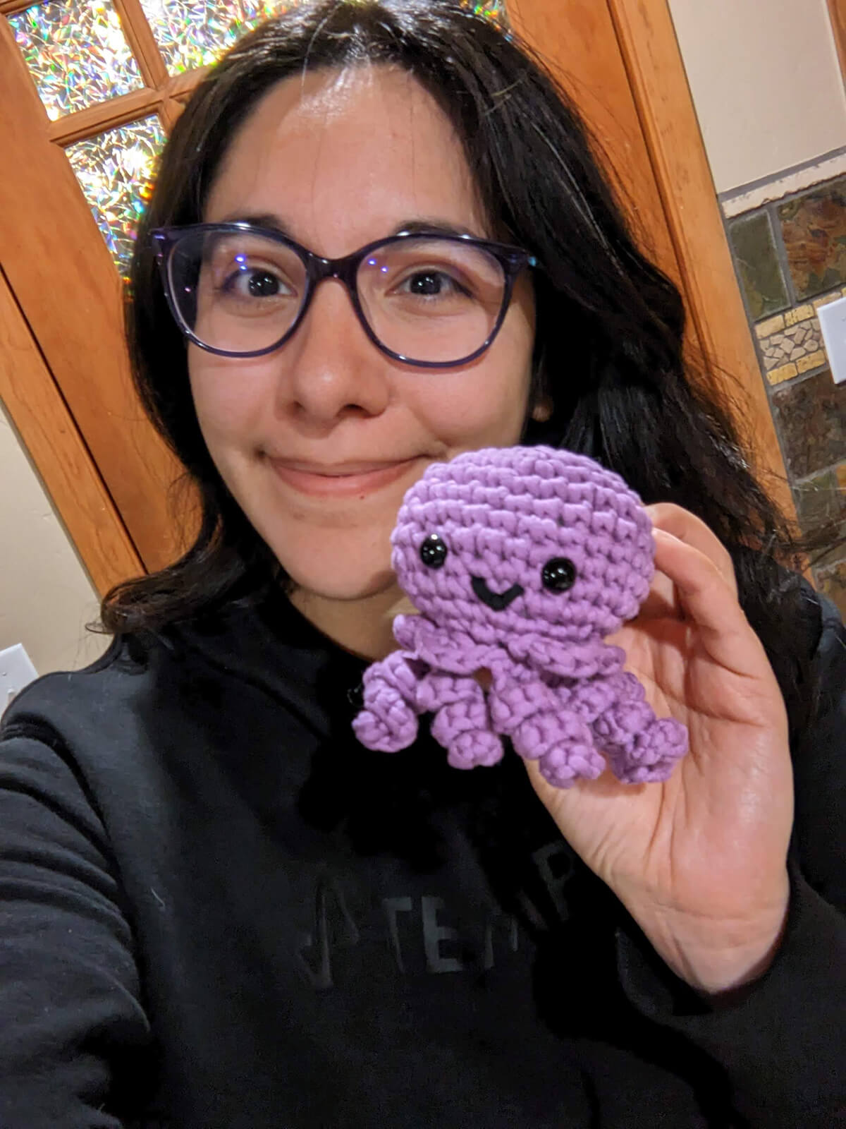 Marie holding a knitted jellyfish